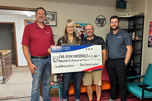 Town & Country staff with owner of Faa Addiction Services for Small Business Grant check presentation